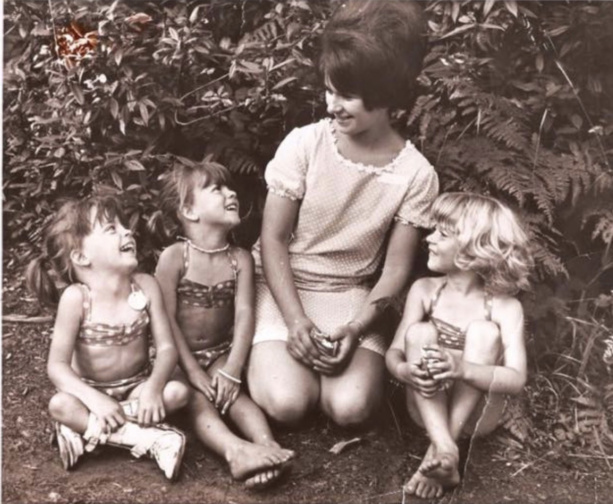 Teri (left) with her twin, Traci, Mom, and sister Tami, 1970.
